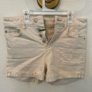 Anthropologie pilcro cream destructed denim shorts.